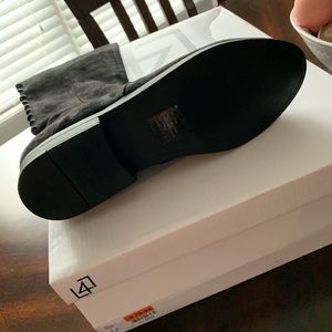 Over-the-knee black lace up boots. Never worn!